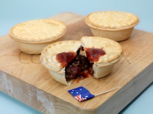 2118155-australian-meat-pies-on-a-chopping-board